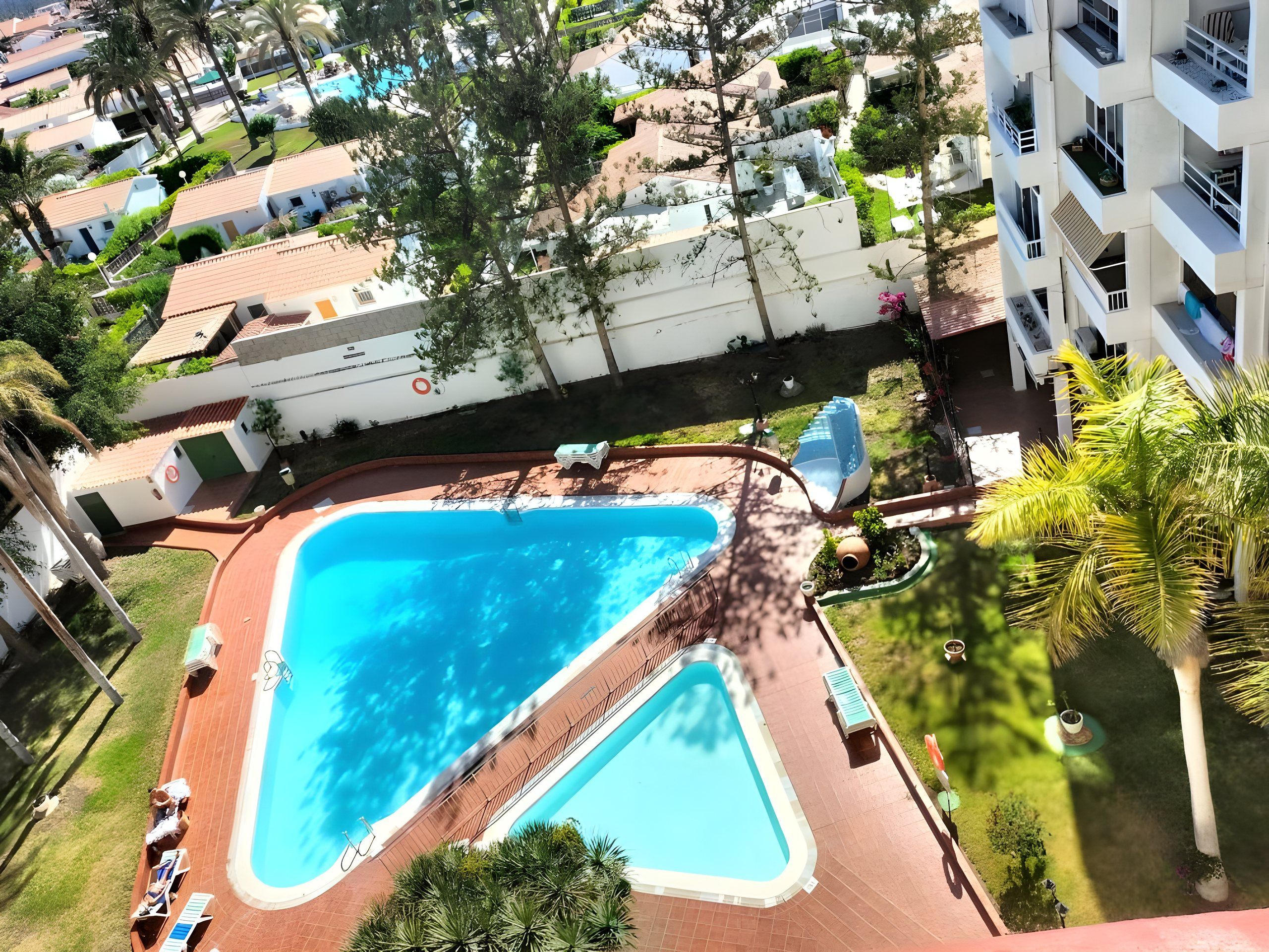 The two swimming pools and the garden seen from above