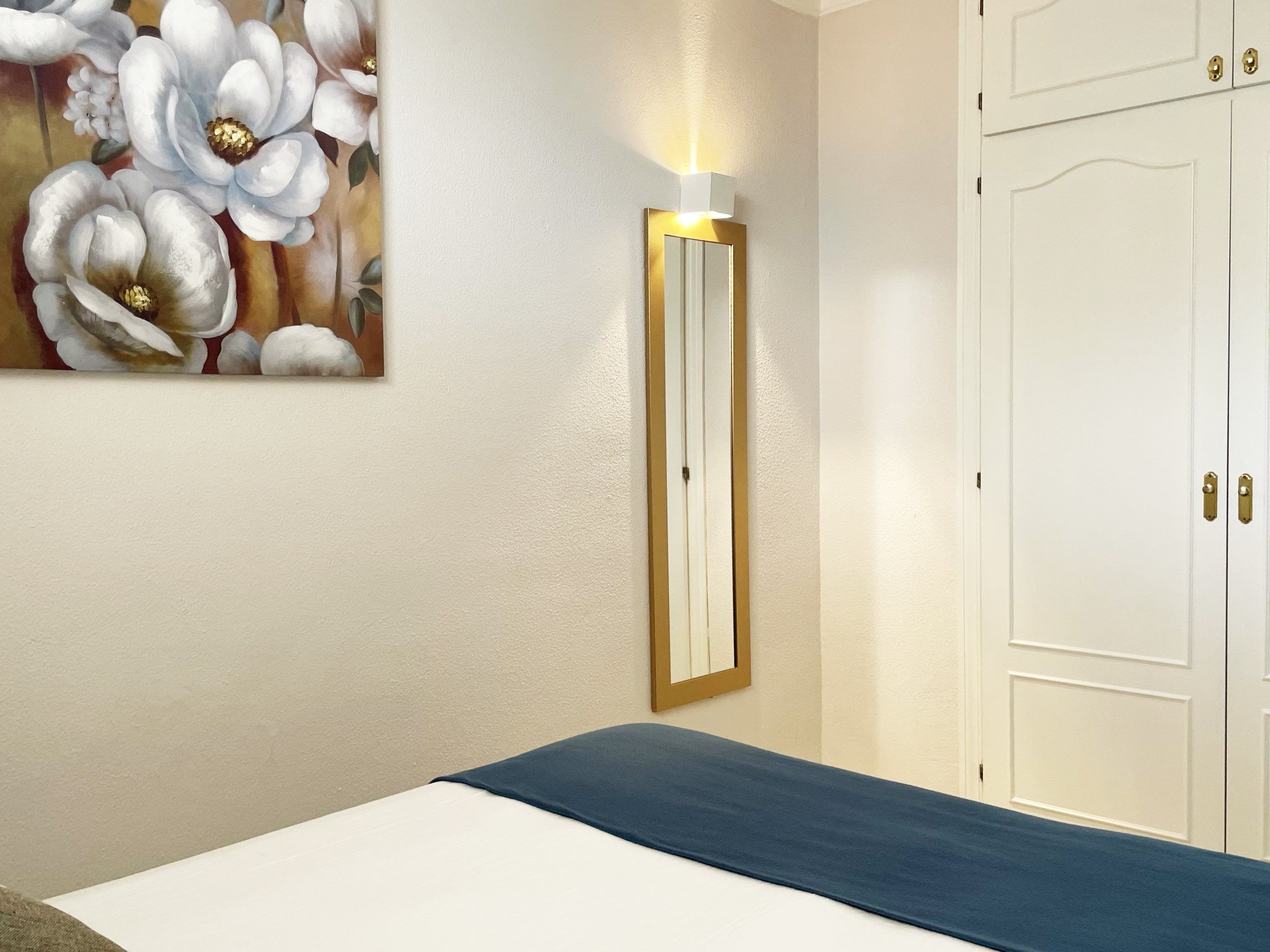 Bedroom with mirror and wardrobe