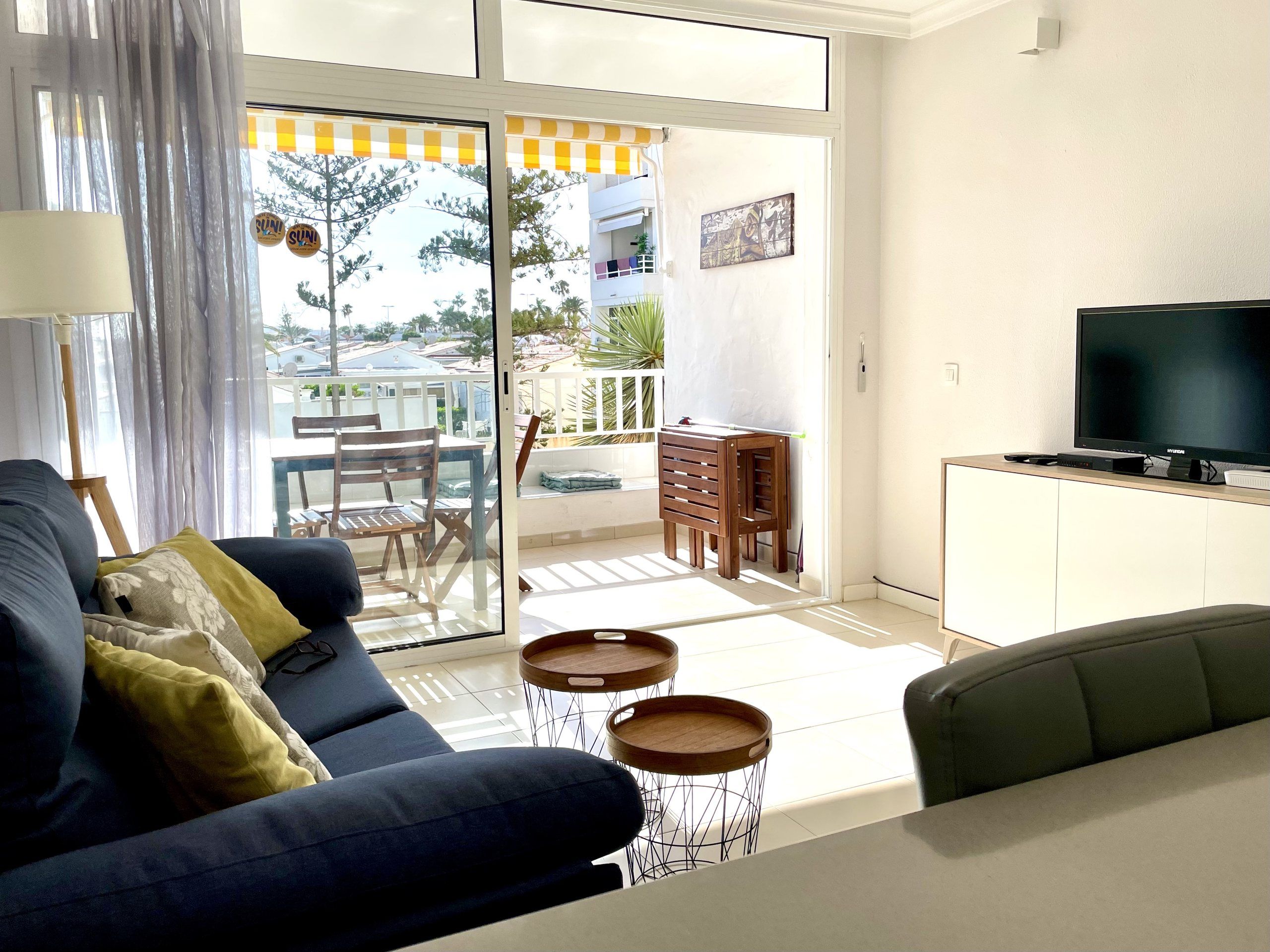 Living room with sliding doors open to the loggia